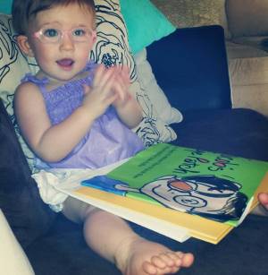 Ella reading Jacob's Eye Patch
